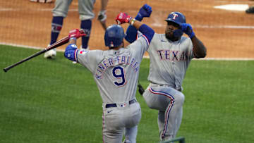 Apr 19, 2021; Anaheim, California, USA; Texas Rangers right fielder Adolis Garcia (53) celebrates with third baseman Isiah Kiner-Falefa (9) after hitting a solo home run in the third inning against the Los Angeles Angels at Angel Stadium. Mandatory Credit: Kirby Lee-USA TODAY Sports