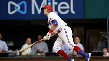 Apr 27, 2021; Arlington, Texas, USA; Texas Rangers second baseman Nick Solak (15) hits a home run during the seventh inning against the Los Angeles Angels at Globe Life Field. Mandatory Credit: Kevin Jairaj-USA TODAY Sports