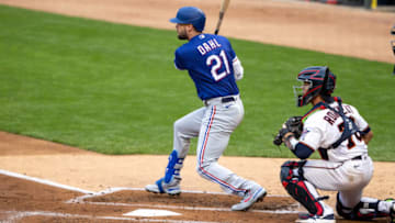 May 3, 2021; Minneapolis, Minnesota, USA; Texas Rangers left fielder David Dahl (21) hits a single during the second inning against the Minnesota Twins at Target Field. Mandatory Credit: Jordan Johnson-USA TODAY Sports