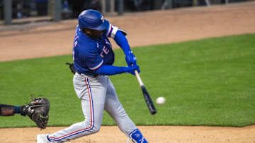 May 4, 2021; Minneapolis, Minnesota, USA; Texas Rangers center fielder Adolis Garcia (53) hits a single in the sixth inning against the Minnesota Twins at Target Field. Mandatory Credit: Jesse Johnson-USA TODAY Sports