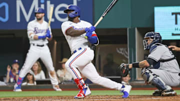 May 18, 2021; Arlington, Texas, USA; Texas Rangers center fielder Adolis Garcia (53) hits a two-run single during the third inning against the New York Yankees at Globe Life Field. Mandatory Credit: Kevin Jairaj-USA TODAY Sports