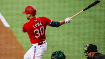 Aug 13, 2021; Arlington, Texas, USA; Texas Rangers first baseman Nathaniel Lowe (30) hits an rbi single during the first inning against the Oakland Athletics at Globe Life Field. Mandatory Credit: Kevin Jairaj-USA TODAY Sports