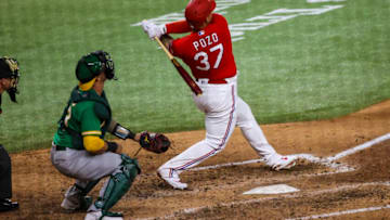 Aug 13, 2021; Arlington, Texas, USA; Texas Rangers designated hitter Yohel Pozo (37) hits a three-run home run during the sixth inning against the Oakland Athletics at Globe Life Field. Mandatory Credit: Kevin Jairaj-USA TODAY Sports