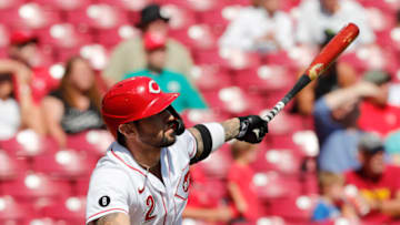 Sep 27, 2021; Cincinnati, Ohio, USA; Cincinnati Reds right fielder Nick Castellanos (2) watches hitting a sacrifice fly against the Pittsburgh Pirates during the first inning at Great American Ball Park. Mandatory Credit: David Kohl-USA TODAY Sports