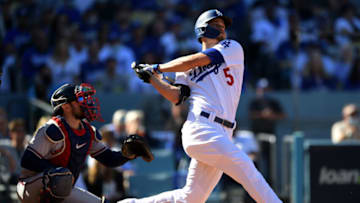 Oct 19, 2021; Los Angeles, California, USA; Los Angeles Dodgers shortstop Corey Seager (5) hits a two-run home run during the first inning of game three of the 2021 NLCS against the Atlanta Braves at Dodger Stadium. Mandatory Credit: Jayne Kamin-Oncea-USA TODAY Sports