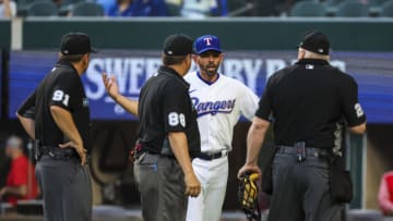 Apr 11, 2022; Arlington, Texas, USA; Texas Rangers manager Chris Woodward (8) argues with the umpires after the game against the Colorado Rockies at Globe Life Field. Mandatory Credit: Kevin Jairaj-USA TODAY Sports