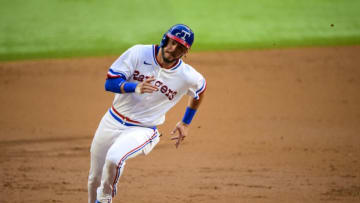 Apr 30, 2022; Arlington, Texas, USA; Texas Rangers left fielder Zach Reks (65) scores against the Atlanta Braves during the second inning at Globe Life Field. Mandatory Credit: Jerome Miron-USA TODAY Sports