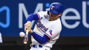 May 12, 2022; Arlington, Texas, USA; Texas Rangers third baseman Brad Miller (13) hits a home run during the seventh inning against the Kansas City Royals at Globe Life Field. Mandatory Credit: Kevin Jairaj-USA TODAY Sports