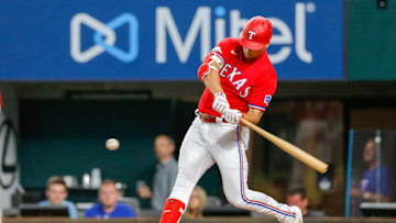 Aug 26, 2022; Arlington, Texas, USA; Texas Rangers first baseman Nathaniel Lowe (30) hits a home run during the first inning against the Detroit Tigers at Globe Life Field. Mandatory Credit: Andrew Dieb-USA TODAY Sports