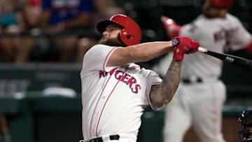 Aug 12, 2017; Arlington, TX, USA; Texas Rangers first baseman Mike Napoli (5) hits a home run against the Houston Astros during the fourth inning at Globe Life Park in Arlington. Mandatory Credit: Jerome Miron-USA TODAY Sports
