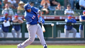 Mar 10, 2019; Scottsdale, AZ, USA; Texas Rangers infielder Curtis Terry (30) hits an RBI single during the ninth inning against the San Francisco Giants at Scottsdale Stadium. Mandatory Credit: Orlando Ramirez-USA TODAY Sports