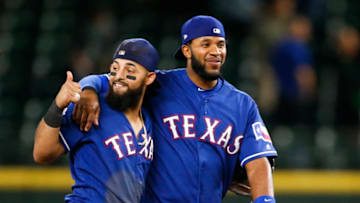 Jul 23, 2019; Seattle, WA, USA; Texas Rangers second baseman Rougned Odor, left, and shortstop Elvis Andrus, right, hug following a 7-2 victory against the Seattle Mariners at T-Mobile Park. Mandatory Credit: Joe Nicholson-USA TODAY Sports