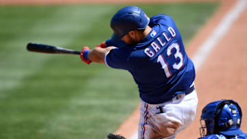 Mar 28, 2021; Surprise, Arizona, USA; Texas Rangers right fielder Joey Gallo (13) hits a home run against the Chicago Cubs during the second inning of a spring training game at Surprise Stadium. Mandatory Credit: Joe Camporeale-USA TODAY Sports