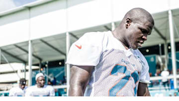 Miami Dolphins running back Frank Gore walks off field after first practice - Image courtesy of the Miami Dolphins