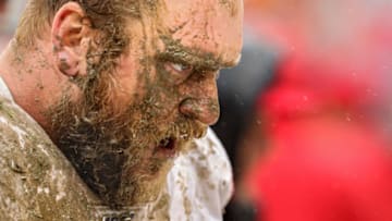 LANDOVER, MARYLAND - OCTOBER 20: Covered in mud, offensive guard Mike Person #68 of the San Francisco 49ers looks on after making a tackle on defensive back Troy Apke #30 of the Washington Redskins (not pictured) during the third quarter at FedExField on October 20, 2019 in Landover, Maryland. (Photo by Patrick Smith/Getty Images)