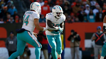 CLEVELAND, OH - NOVEMBER 24: Ryan Fitzpatrick #14 of the Miami Dolphins hands the ball off to Kalen Ballage #27 during the game against the Cleveland Browns at FirstEnergy Stadium on November 24, 2019 in Cleveland, Ohio. (Photo by Kirk Irwin/Getty Images)