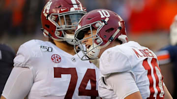 AUBURN, ALABAMA - NOVEMBER 30: Mac Jones #10 of the Alabama Crimson Tide reacts after passing for a touchdown reception to Jaylen Waddle #17 in the first half against the Auburn Tigers at Jordan Hare Stadium on November 30, 2019 in Auburn, Alabama. (Photo by Kevin C. Cox/Getty Images)