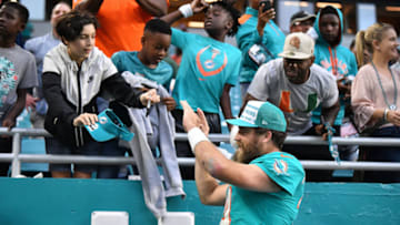 MIAMI, FLORIDA - DECEMBER 22: Ryan Fitzpatrick #14 of the Miami Dolphins celebrates with fans after the overtime win against the Cincinnati Bengals at Hard Rock Stadium on December 22, 2019 in Miami, Florida. (Photo by Mark Brown/Getty Images)