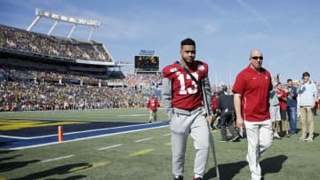 ORLANDO, FL - JANUARY 01: Injured quarterback Tua Tagovailoa #13 of the Alabama Crimson Tide leaves the field after watching warmups prior to the Vrbo Citrus Bowl against the Michigan Wolverines at Camping World Stadium on January 1, 2020 in Orlando, Florida. (Photo by Joe Robbins/Getty Images)