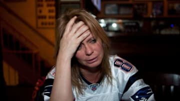 BOSTON, MA - FEBRUARY 5: New England Patriots fan Suzanne Roy cries after the Patriots lost the Super Bowl XLVI on February 5, 2012 in Boston, Massachusetts. The New York Giants defeated the New England Patriots in a 21 to 17 fourth-quarter victory. (Photo by Kayana Szymczak/Getty Images)