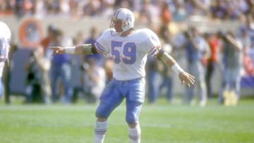 CHICAGO, IL - OCTOBER 15: John Grimsley #59 of the Houston Oilers lines up during a football game against the Chicago Bears on October 15, 1989 at Soldier Field in Chicago, Illinois. The Oilers won 33-28. (Photo by Mitchell Layton/Getty Images)