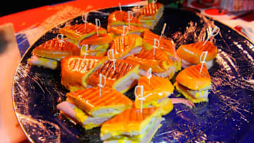 MIAMI, FL - FEBRUARY 21: Cuban Guys Sandwiches attends Botran's Medianoches & Mixology presented by Smithfield At Wynwood Walls hosted by Anne Burrell and Emilio Estefan during the Food Network South Beach Wine & Food Festival at Wynwood Walls on February 21, 2014 in Miami, Florida. (Photo by Sergi Alexander/Getty Images for Food Network SoBe Wine & Food Festival)