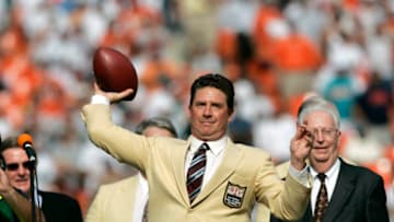 MIAMI, FL - NOVEMBER 6: Former Miami Dolphins quarterback Dan Marino throws one last pass during a ceremony at halftime of a game against the Atlanta Falcons at Dolphins Stadium on November 6, 2005 in Miami, Florida. The Falcons defeated the Dolphins 17-10. (Photo by Joe Robbins/Getty Images)
