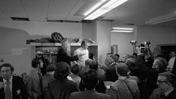 NEW YORK - DECEMBER 10: Head coach Don Shula (center) of the Miami Dolphins talks with the media in the lockerroom after a game on December 10, 1972 against the New York Giants at Yankee Stadium in New York, New York. (Photo by: Kidwiler Collection/Diamond Images/Getty Images)