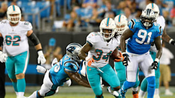 CHARLOTTE, NC - AUGUST 17: Senorise Perry #34 of the Miami Dolphins runs the ball against the Carolina Panthers in the second quarter during the game at Bank of America Stadium on August 17, 2018 in Charlotte, North Carolina. (Photo by Grant Halverson/Getty Images)