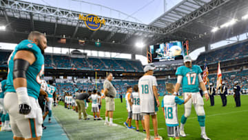 MIAMI, FL - AUGUST 25: Ryan Tannehill #17 of the Miami Dolphins high fives fans during the National Anthem before a preseason game against the Baltimore Ravens at Hard Rock Stadium on August 25, 2018 in Miami, Florida. (Photo by Mark Brown/Getty Images)