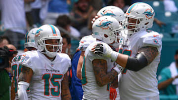 MIAMI, FL - SEPTEMBER 09: (L-R) Albert Wilson #15, Daniel Kilgore #67, and Kenny Stills #10 of the Miami Dolphins celebrate the touchdown in the second quarter against the Tennessee Titans at Hard Rock Stadium on September 9, 2018 in Miami, Florida. (Photo by Mark Brown/Getty Images)