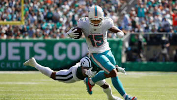 EAST RUTHERFORD, NJ - SEPTEMBER 16: Wide receiver Albert Wilson #15 of the Miami Dolphins carries the ball in for a touchdown against defensive back Buster Skrine #41 of the New York Jets during the second quarter at MetLife Stadium on September 16, 2018 in East Rutherford, New Jersey. (Photo by Michael Owens/Getty Images)