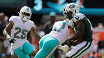 EAST RUTHERFORD, NJ - SEPTEMBER 16: Wide receiver Quincy Enunwa #81 of the New York Jets is tackled by linebacker Kiko Alonso #47 of the Miami Dolphins during the first half at MetLife Stadium on September 16, 2018 in East Rutherford, New Jersey. (Photo by Elsa/Getty Images)