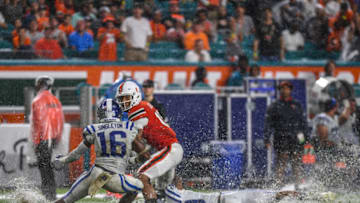 MIAMI, FL - NOVEMBER 03: Dylan Singleton #16 of the Duke Blue Devils attempts to tackle Lawrence Cager #18 of the Miami Hurricanes in the first half against the during the game between the Miami Hurricanes and the Duke Blue Devils at Hard Rock Stadium on November 3, 2018 in Miami, Florida. (Photo by Mark Brown/Getty Images)