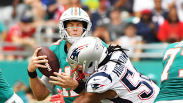 MIAMI, FL - DECEMBER 09: Ryan Tannehill #17 of the Miami Dolphins sacked by Dont'a Hightower #54 of the New England Patriots during the second quarter at Hard Rock Stadium on December 9, 2018 in Miami, Florida. (Photo by Mark Brown/Getty Images)