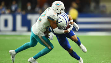 INDIANAPOLIS, INDIANA - NOVEMBER 25: Jordan Wilkins #20 of the Indianapolis Colts is tackled by T.J. McDonald #22 of the Miami Dolphins in the second quarter at Lucas Oil Stadium on November 25, 2018 in Indianapolis, Indiana. (Photo by Stacy Revere/Getty Images)
