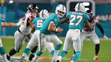 MIAMI, FL - AUGUST 08: Josh Rosen #3 looks to hand off to Kalen Ballage #27 of the Miami Dolphins in the second quarter during a preseason game against the Atlanta Falcons at Hard Rock Stadium on August 8, 2019 in Miami, Florida. (Photo by Mark Brown/Getty Images)