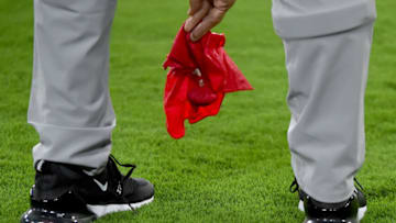 BALTIMORE, MD - AUGUST 15: Head coach John Harbaugh of the Baltimore Ravens picks up his challenge flag after challenging a play during the first half of a preseason game against the Green Bay Packers at M&T Bank Stadium on August 15, 2019 in Baltimore, Maryland. (Photo by Will Newton/Getty Images)