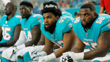 MIAMI, FLORIDA - AUGUST 08: Christian Wilkins #97 of the Miami Dolphins looks on from the sideline during the first quarter of the preseason game at Hard Rock Stadium on August 08, 2019 in Miami, Florida. (Photo by Michael Reaves/Getty Images)