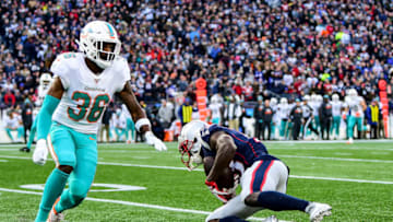 FOXBOROUGH, MA - DECEMBER 29: Phillip Dorsett II #13 of the New England Patriots catches a pass as he is defended by Adrian Colbert #36 of the Miami Dolphins during the second quarter of a game at Gillette Stadium on December 29, 2019 in Foxborough, Massachusetts. (Photo by Billie Weiss/Getty Images)