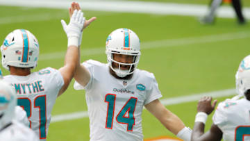MIAMI GARDENS, FLORIDA - SEPTEMBER 20: Ryan Fitzpatrick #14 of the Miami Dolphins celebrates with teammates after a touchdown against the Buffalo Bills during the first half at Hard Rock Stadium on September 20, 2020 in Miami Gardens, Florida. (Photo by Michael Reaves/Getty Images)