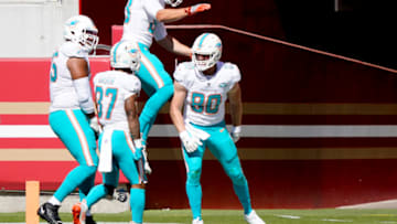 SANTA CLARA, CALIFORNIA - OCTOBER 11: Adam Shaheen #80 of the Miami Dolphins celebrates with teammates after he scored a touchdown against the San Francisco 49ers during the first half of their NFL football game at Levi's Stadium on October 11, 2020 in Santa Clara, California. (Photo by Thearon W. Henderson/Getty Images)