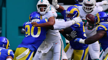 MIAMI GARDENS, FLORIDA - NOVEMBER 01: Tua Tagovailoa #1 of the Miami Dolphins is hit by Michael Brockers #90 of the Los Angeles Rams during their NFL game at Hard Rock Stadium on November 01, 2020 in Miami Gardens, Florida. (Photo by Mark Brown/Getty Images)