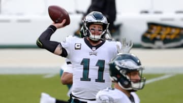 GREEN BAY, WISCONSIN - DECEMBER 06: Carson Wentz #11 of the Philadelphia Eagles participates in warmups prior to a game against the Green Bay Packers at Lambeau Field on December 06, 2020 in Green Bay, Wisconsin. The Packers defeated the Eagles 30-16. (Photo by Stacy Revere/Getty Images)
