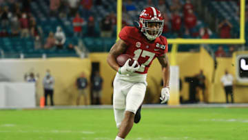 MIAMI GARDENS, FLORIDA - JANUARY 11: Jaylen Waddle #17 of the Alabama Crimson Tide rushes during the first quarter of the College Football Playoff National Championship game against the Ohio State Buckeyes at Hard Rock Stadium on January 11, 2021 in Miami Gardens, Florida. (Photo by Mike Ehrmann/Getty Images)