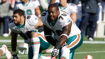 FOXBORO, MA - DECEMBER 24: Kendall Langford #70 of the Miami Dolphins stretches prior to a game between the New England Patriots and the Miami Dolphins at Gillette Stadium on December 24, 2011 in Foxboro, Massachusetts. (Photo by Winslow Townson/Getty Images)