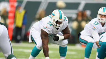EAST RUTHERFORD, NJ - DECEMBER 01: John Jerry #74 of the Miami Dolphins in action against the New York Jets during their game at MetLife Stadium on December 1, 2013 in East Rutherford, New Jersey. (Photo by Al Bello/Getty Images)