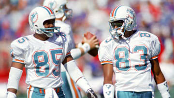ORCHARD PARK, NY - OCTOBER 4: Wide receiver Mark Duper #85 and Mark Clayton #83 of the Miami Dolphins talk during a game against the Buffalo Bills at Ralph Wilson Stadium on October 4, 1992 in Orchard Park, New York. The Dolphins won 37-10. (Photo by Rick Stewart/Getty Images)