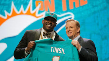 CHICAGO, IL - APRIL 28: (L-R) Laremy Tunsil of Ole Miss holds up a jersey with NFL Commissioner Roger Goodell after being picked #13 overall by the Miami Dolphins during the first round of the 2016 NFL Draft at the Auditorium Theatre of Roosevelt University on April 28, 2016 in Chicago, Illinois. (Photo by Jon Durr/Getty Images)