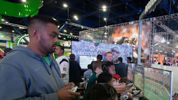 HOUSTON, TX - JANUARY 29: Fans play the Madden Football game at the NFL Experience at the George R. Brown Convention Center on January 31, 2017 in Houston, Texas. (Photo by Bob Levey/Getty Images)